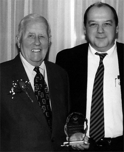 Picture of Dr. Harry C. Rowsell receiving the first award